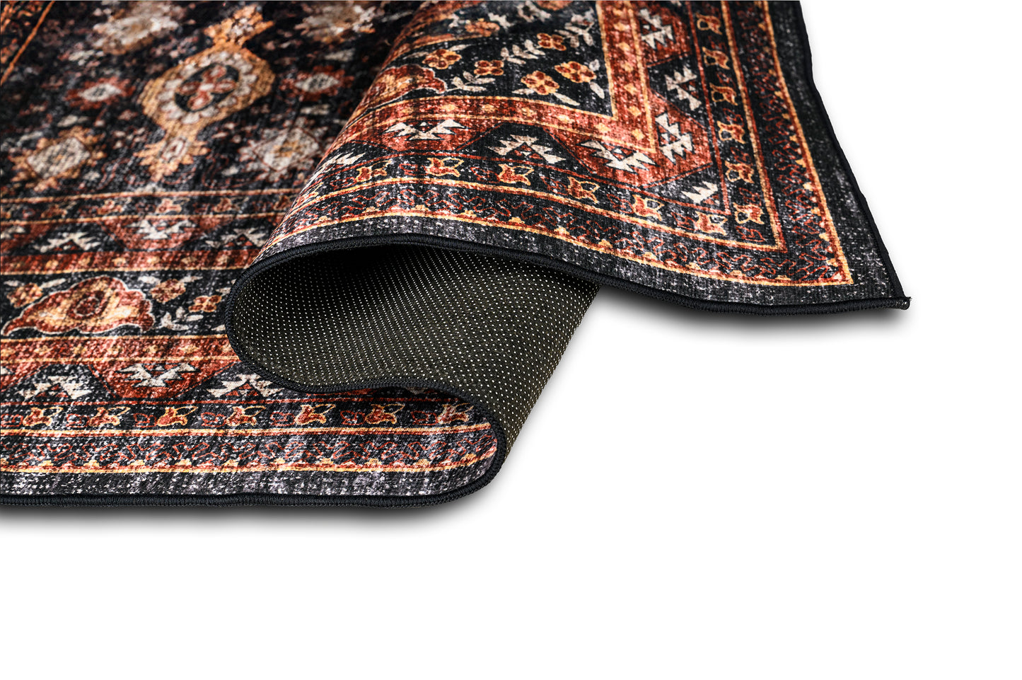 Close-up of a patterned rug with a textured border on a white background