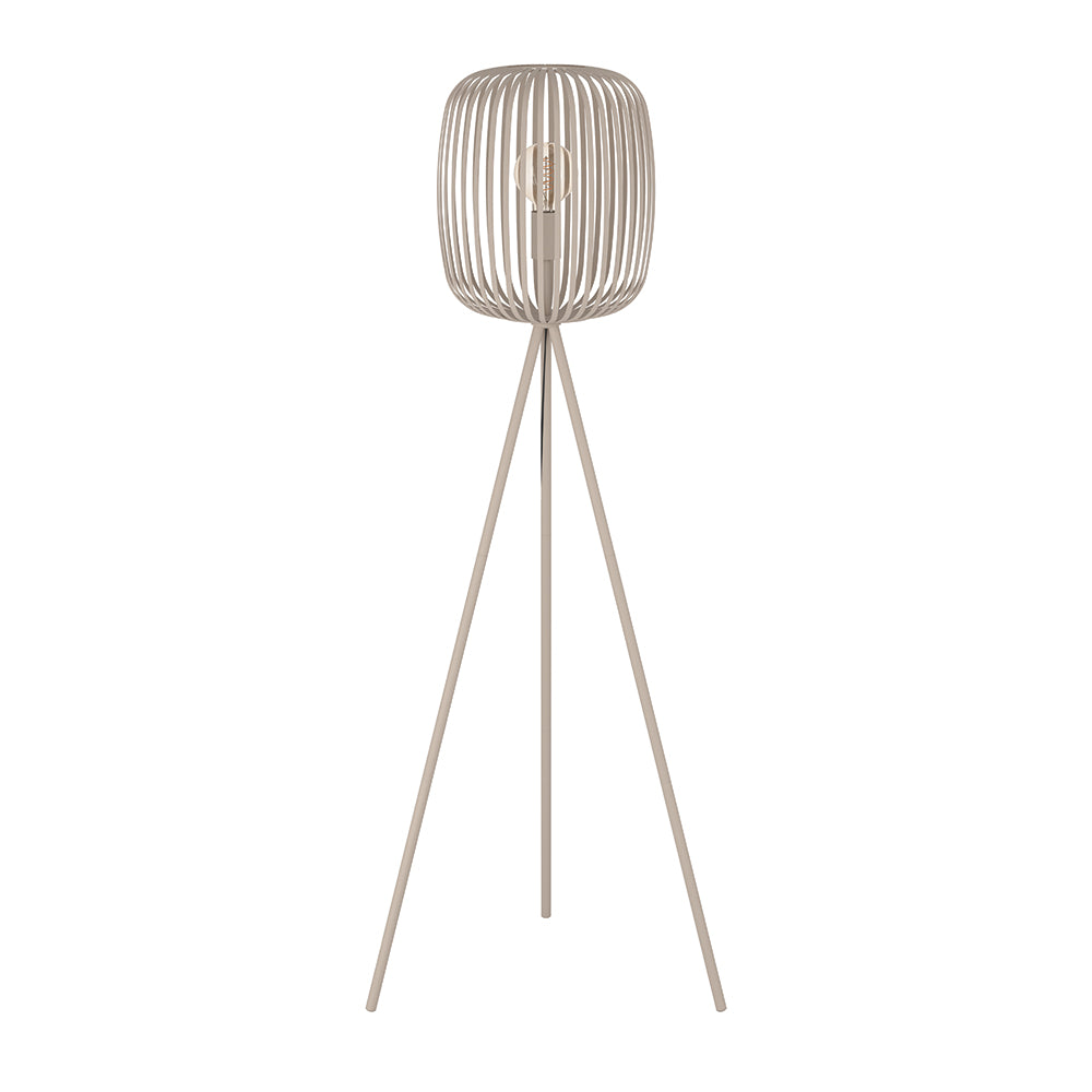 Floor lamp with a ribbed design on top and thin legs on a white background