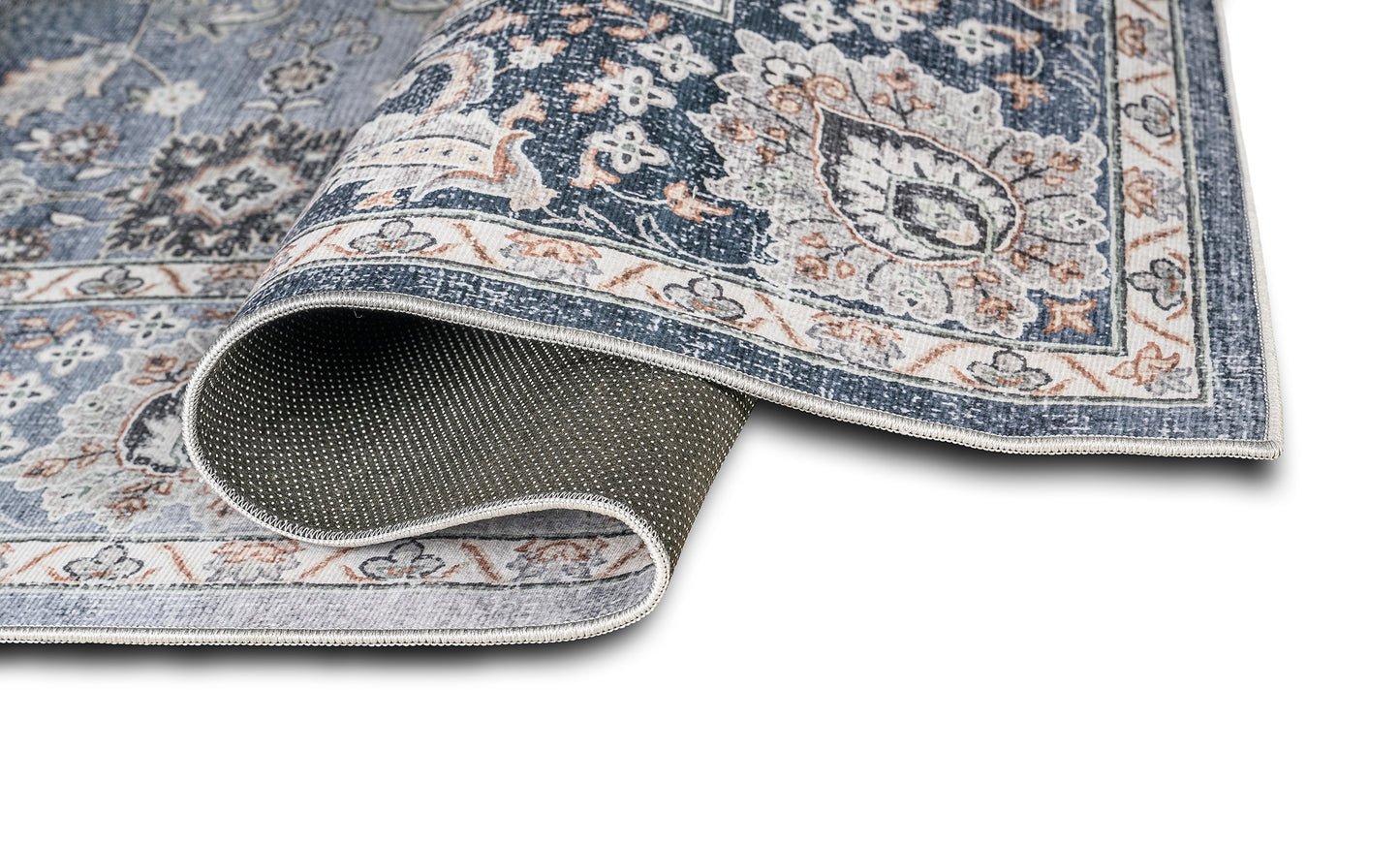 Patterned rug with a textured border on a white background