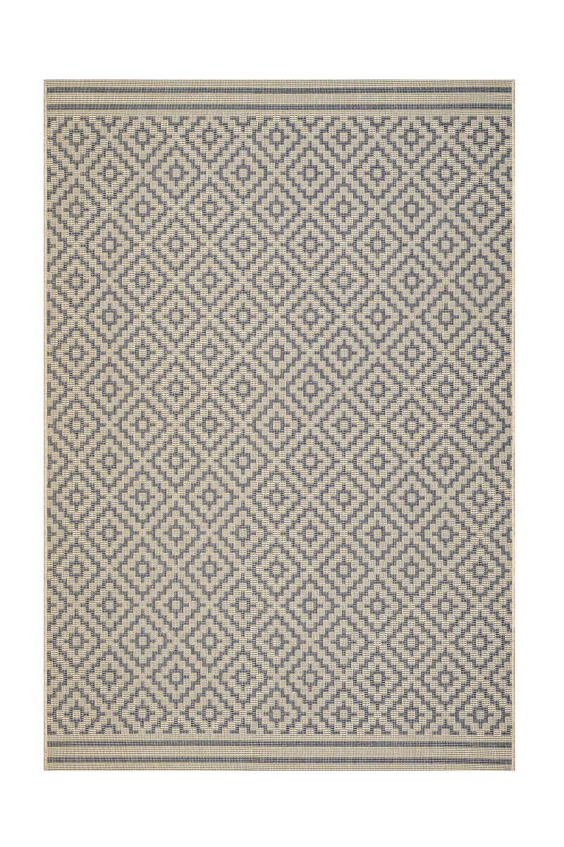 Patterned rug with geometric design on a white background