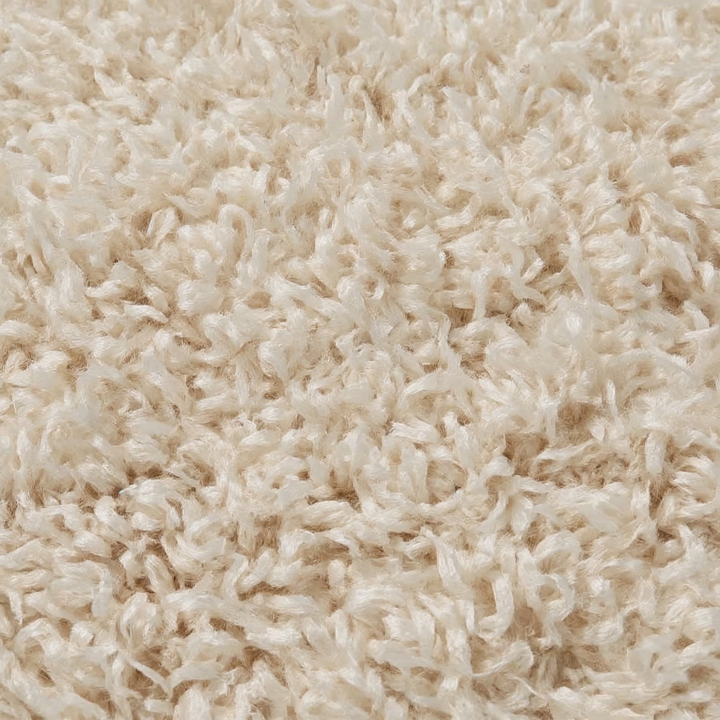 Close-up of beige shaggy carpet texture