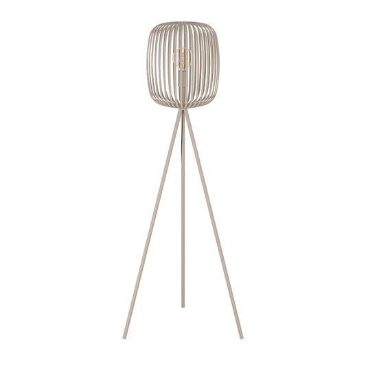 Floor lamp with a ribbed design on top and thin legs on a white background
