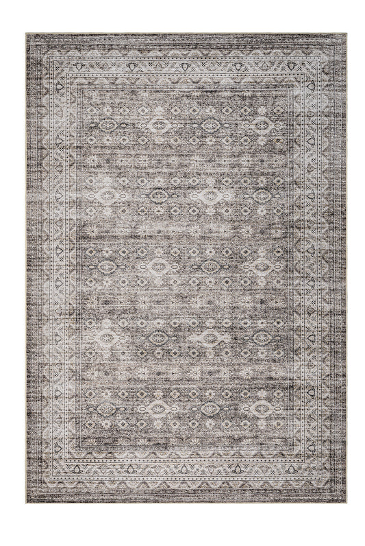 Patterned rug with geometric design on a white background