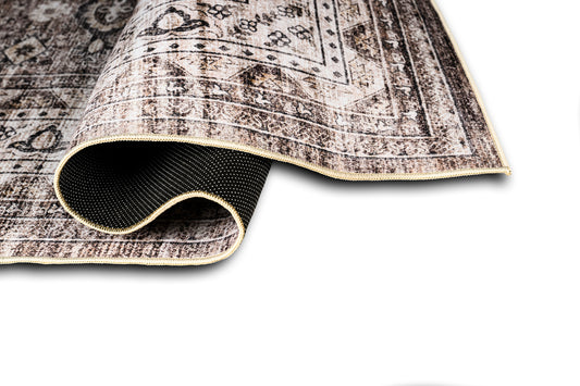 Close-up of a patterned rug with a white background