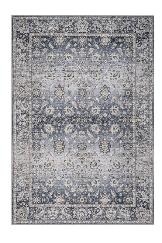 Decorative rug with intricate patterns in blue and beige on a white background