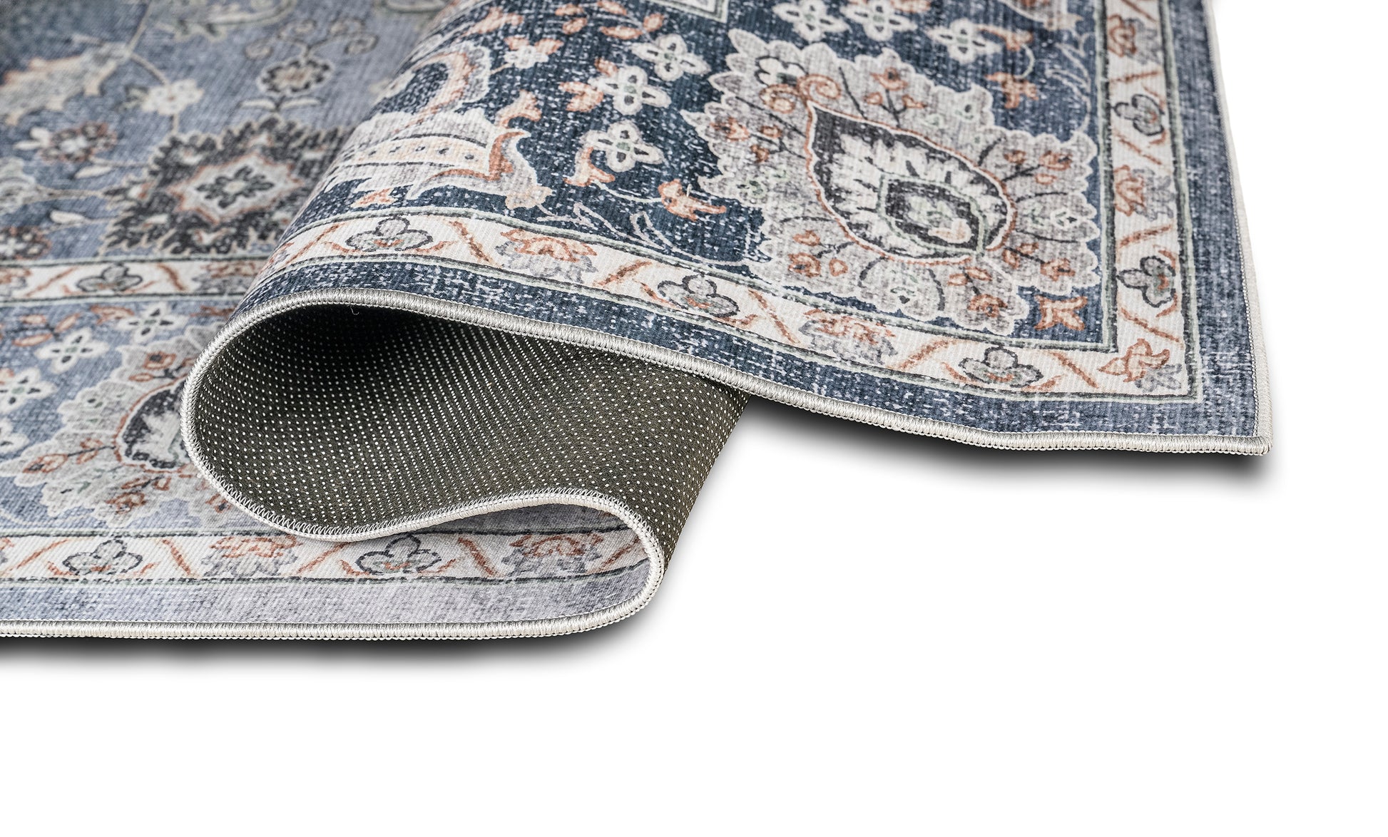 Patterned rug with a textured border on a white background