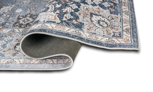 Patterned rug with a textured border on a white background