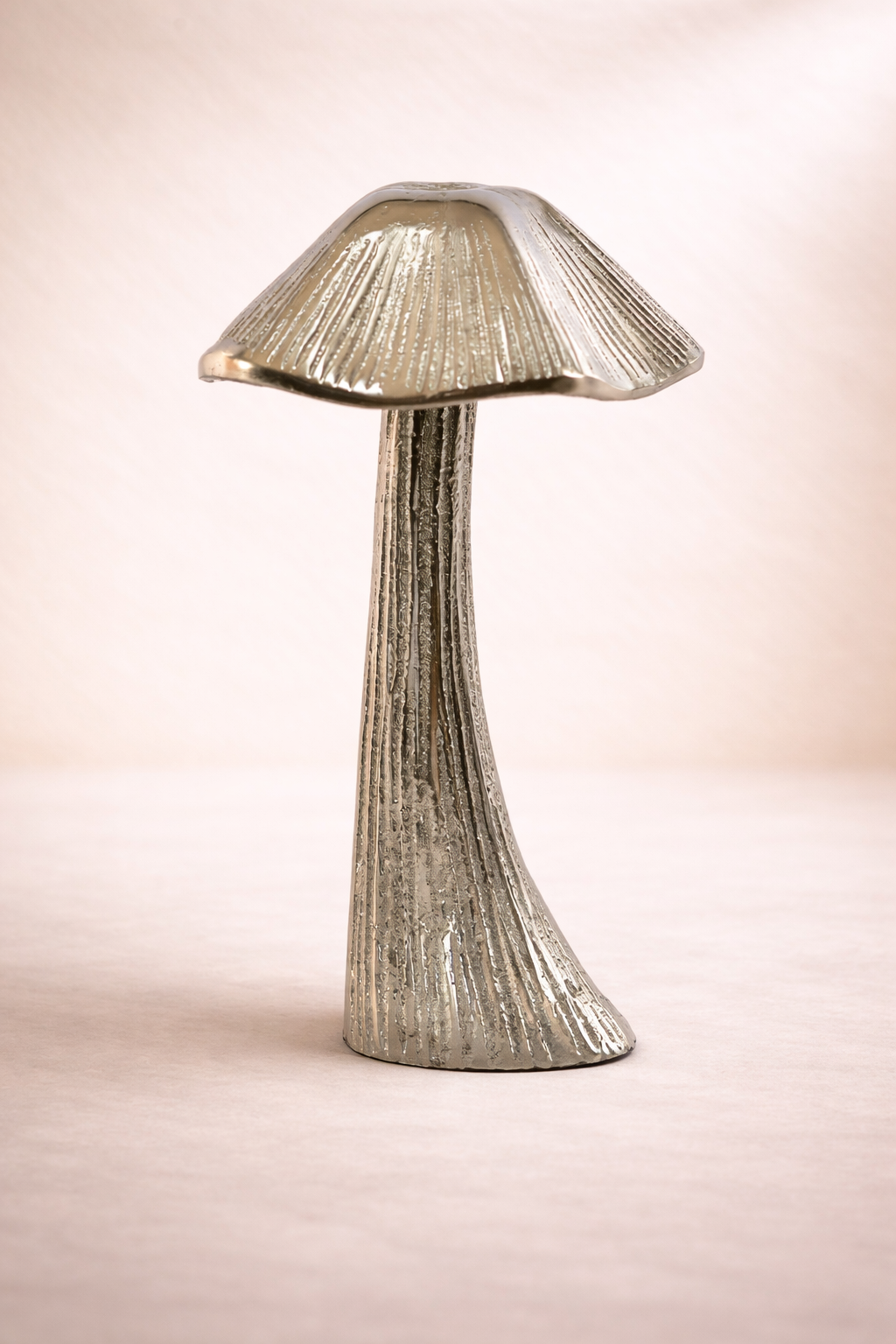 Mushroom-shaped lamp on a plain background