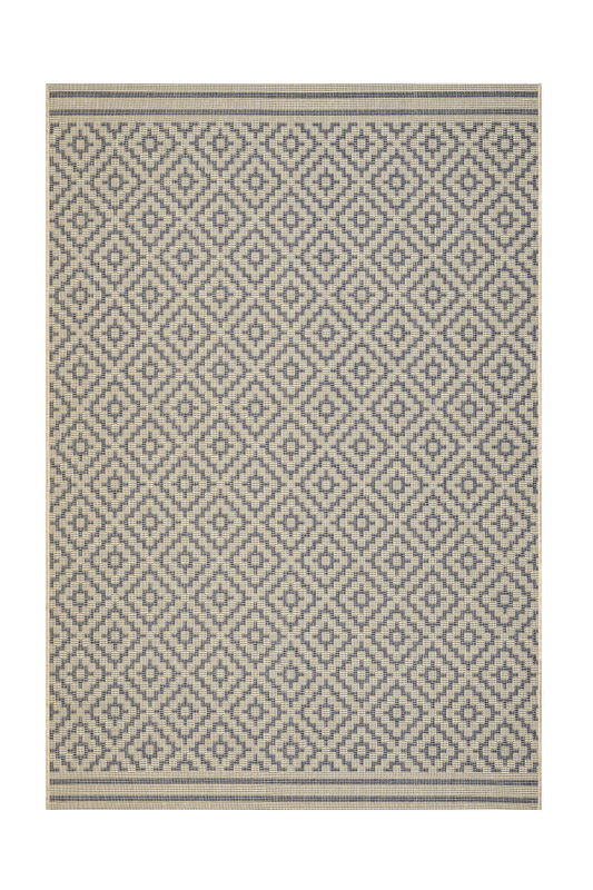 Patterned rug with geometric design on a white background
